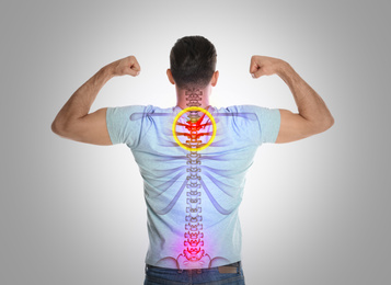 Man with healthy back on light background. Spine pain prevention