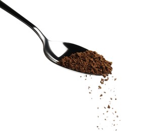 Photo of Pouring aromatic instant coffee from spoon on white background