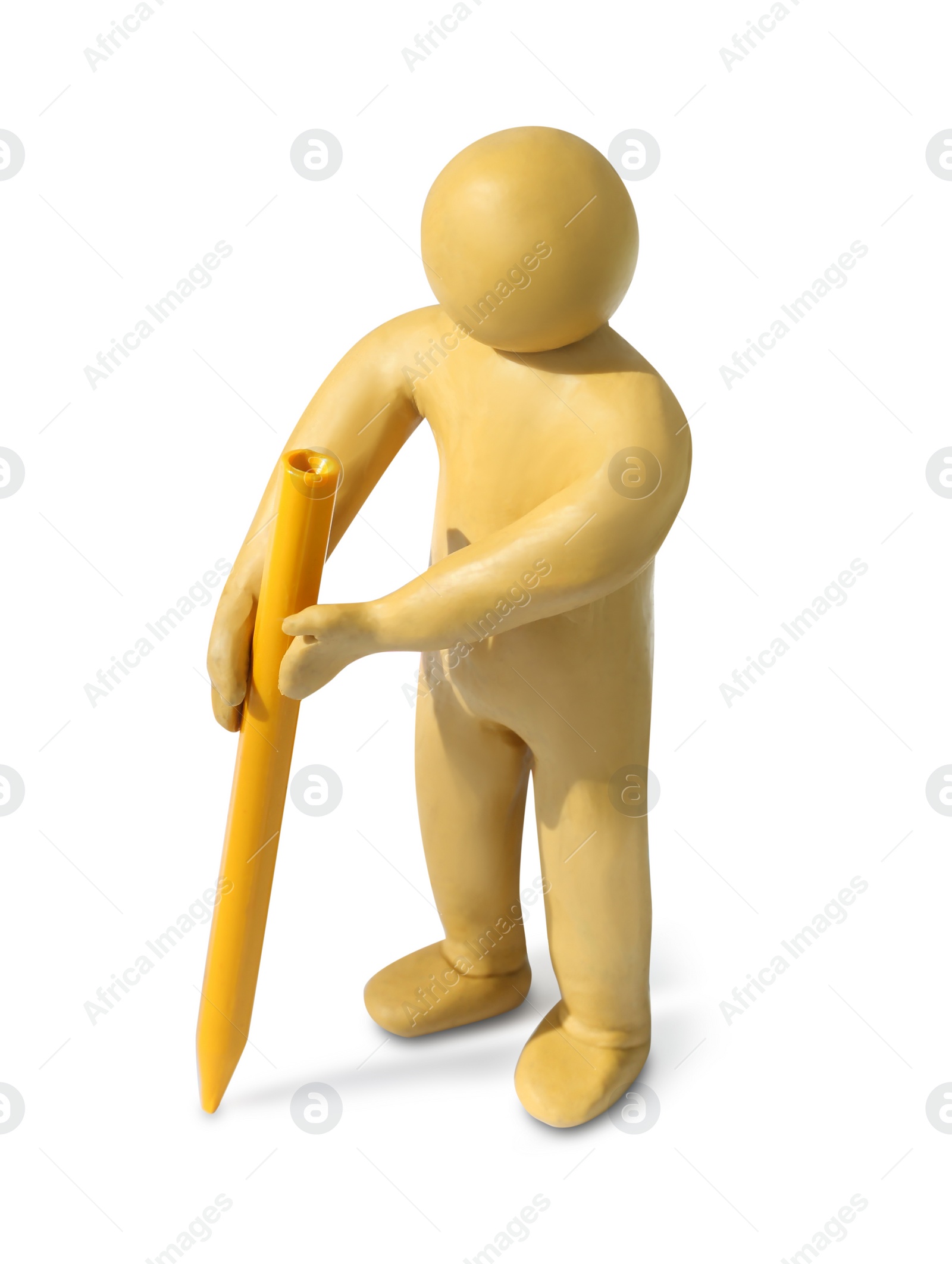 Photo of Yellow plasticine human figure with wax pencil isolated on white