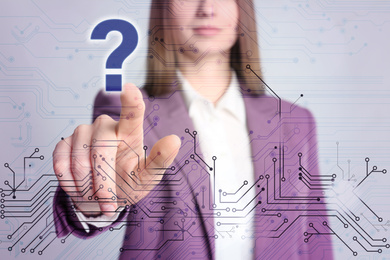 Woman using virtual screen with question mark symbol and scheme, closeup