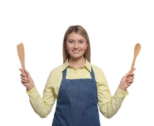 Photo of Beautiful young woman in denim apron with cooking utensils on white background