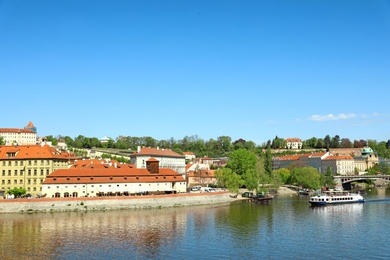 PRAGUE, CZECH REPUBLIC - APRIL 25, 2019: Cityscape with tourist attractions and Vltava river