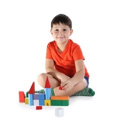 Cute child playing with colorful blocks on white background