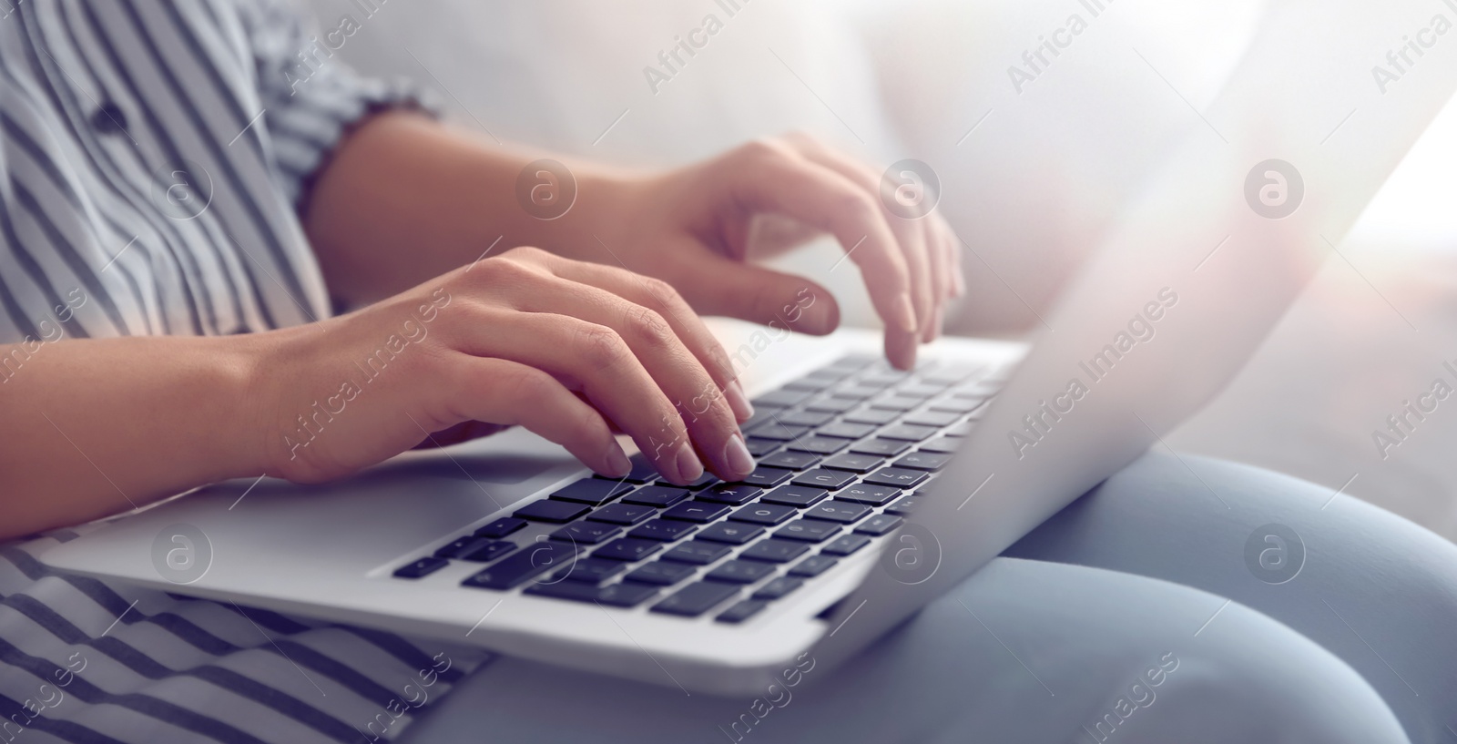 Image of Young woman working on computer indoors, closeup. Banner design