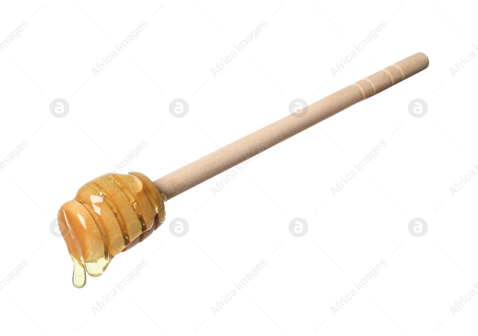 Photo of Natural honey dripping from dipper on white background