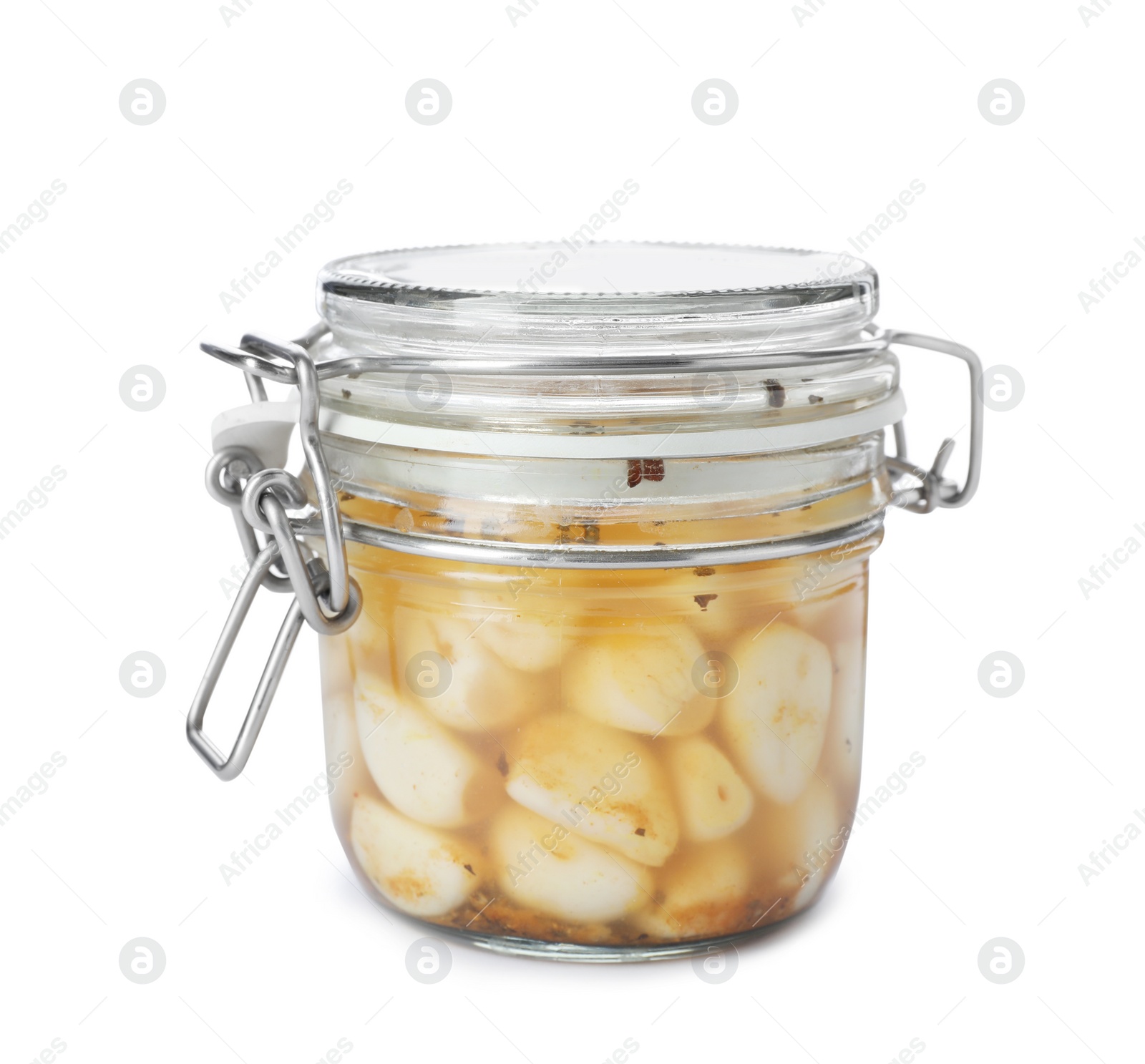 Photo of Glass jar with preserved garlic on white background