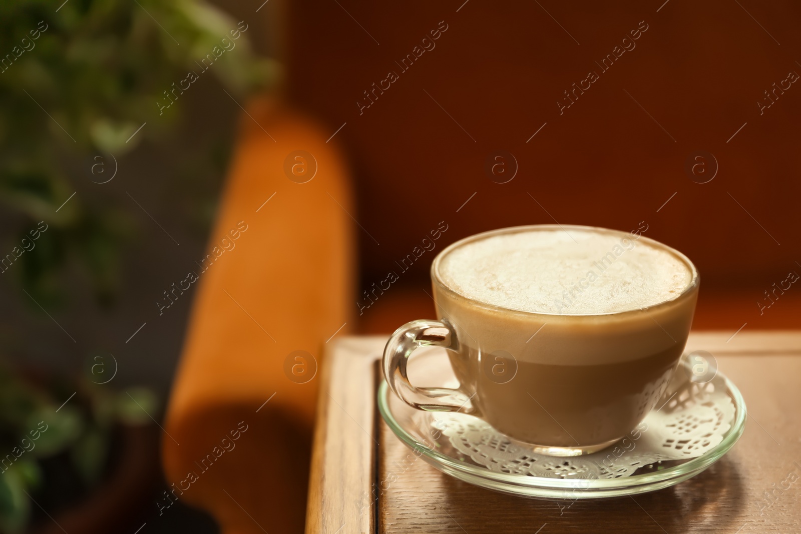 Photo of Cup of delicious aromatic coffee on table