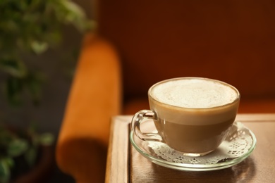 Photo of Cup of delicious aromatic coffee on table