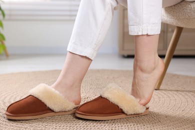 Woman in soft slippers at home, closeup