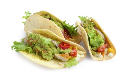 Delicious tacos with guacamole and vegetables isolated on white