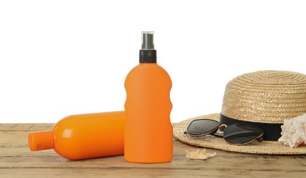 Photo of Sun protection products and beach accessories on wooden table