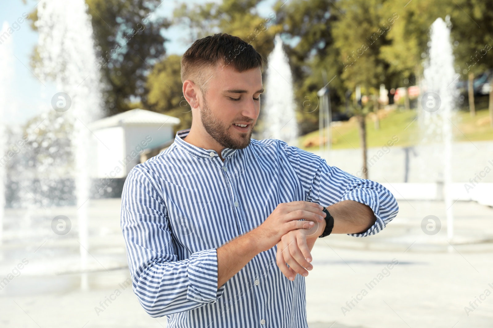 Photo of Portrait of handsome young man on street