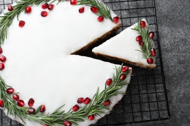 Photo of Flat lay composition with traditional Christmas cake on grey table