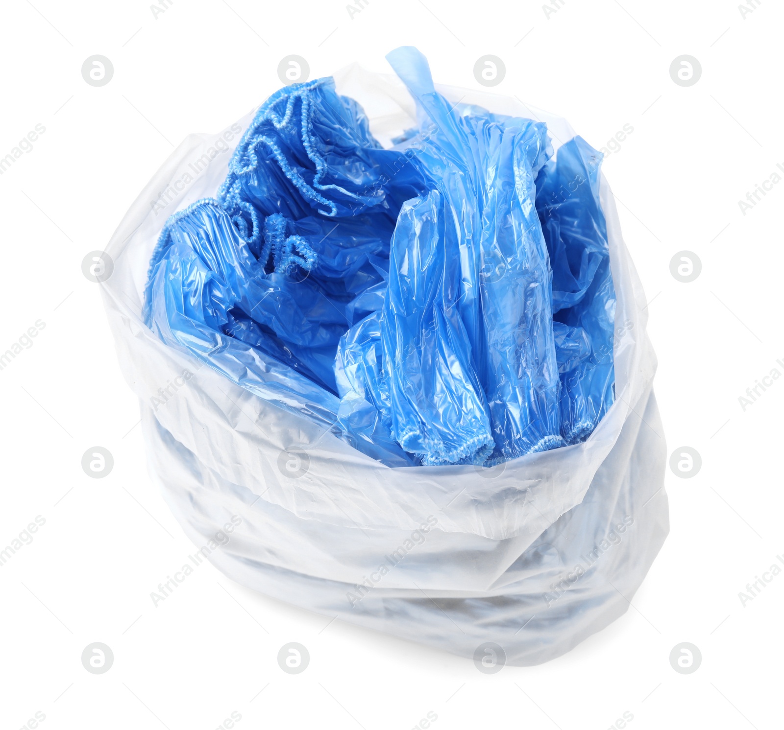 Photo of Blue medical shoe covers in package isolated on white