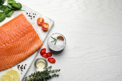 Photo of Fresh raw salmon and ingredients for marinade on white wooden table, flat lay. Space for text