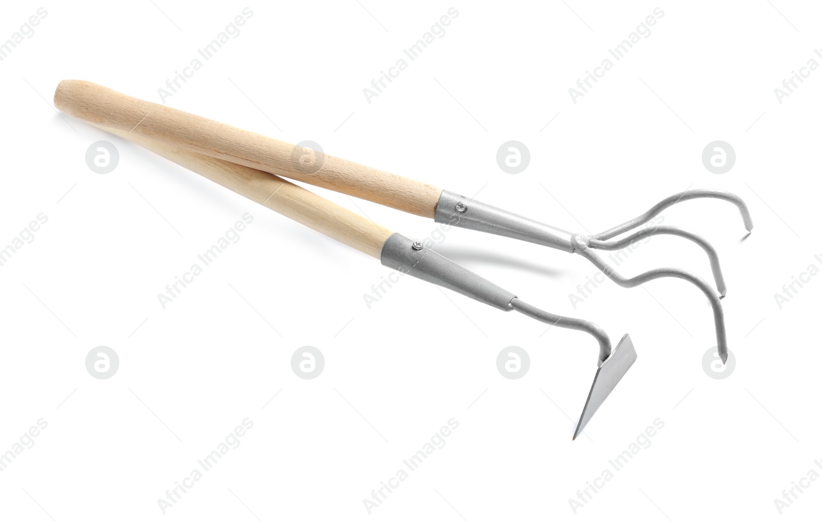 Photo of New rake and hoe on white background. Professional gardening tools