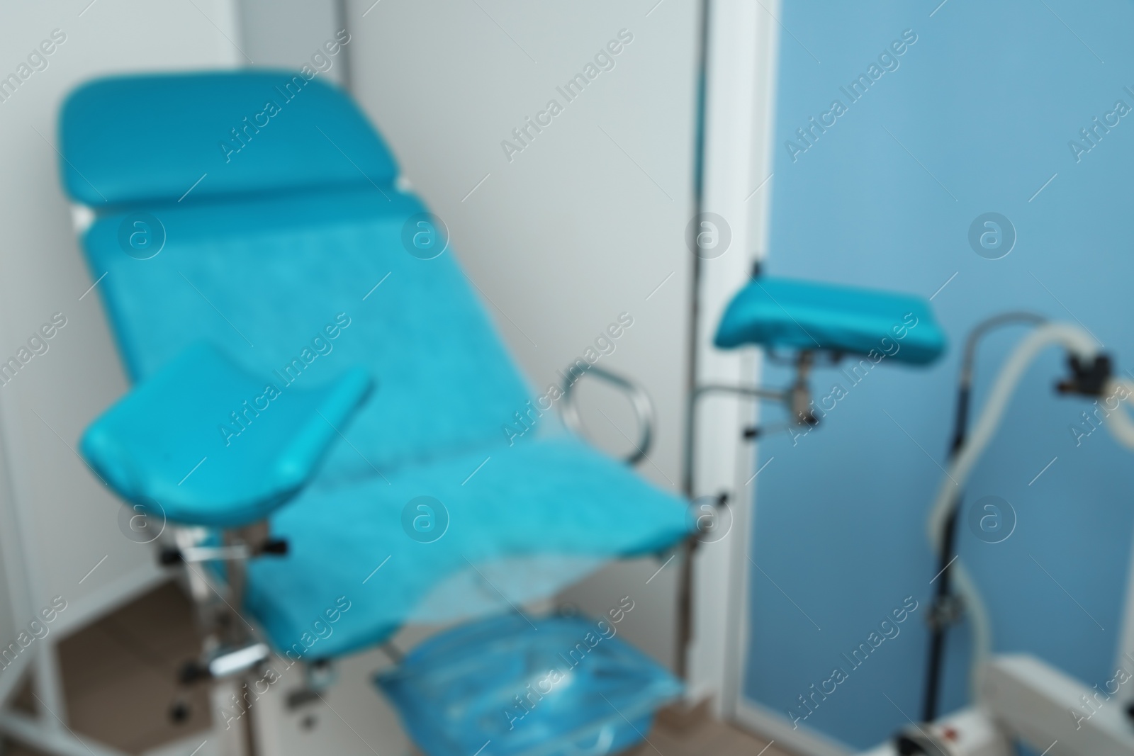 Photo of Blurred view of gynecological chair in modern clinic