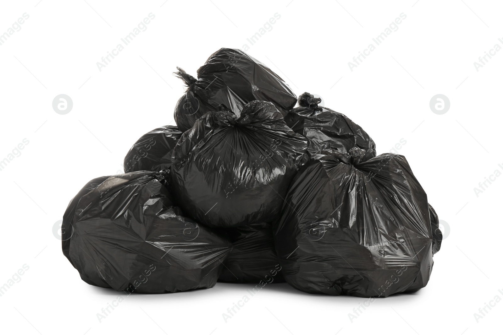 Photo of Black trash bags filled with garbage on white background