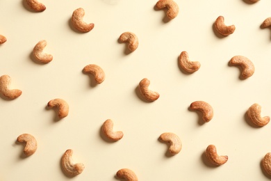Tasty cashew nuts on light background, flat lay