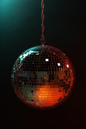 Shiny bright disco ball on dark background