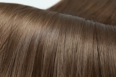 Beautiful brown hair, closeup view. Professional hairdresser