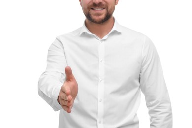 Man welcoming and offering handshake on white background, closeup