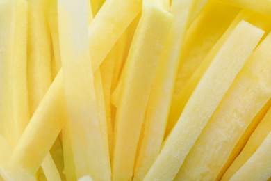 Photo of Raw white carrot sticks as background, closeup