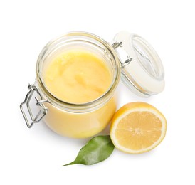 Photo of Delicious lemon curd in glass jar, fresh citrus fruit and green leaf isolated on white, above view