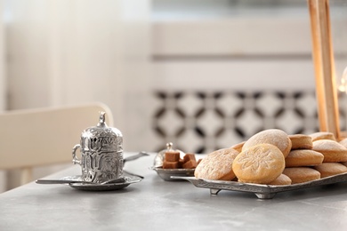 Traditional cookies for Islamic holidays on table indoors. Eid Mubarak