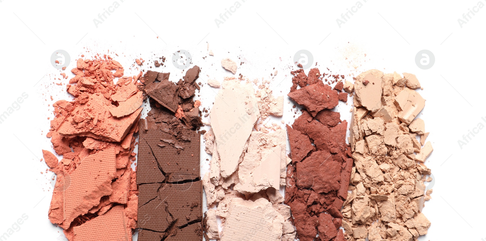 Photo of Crushed eye shadows on white background, top view. Professional makeup product