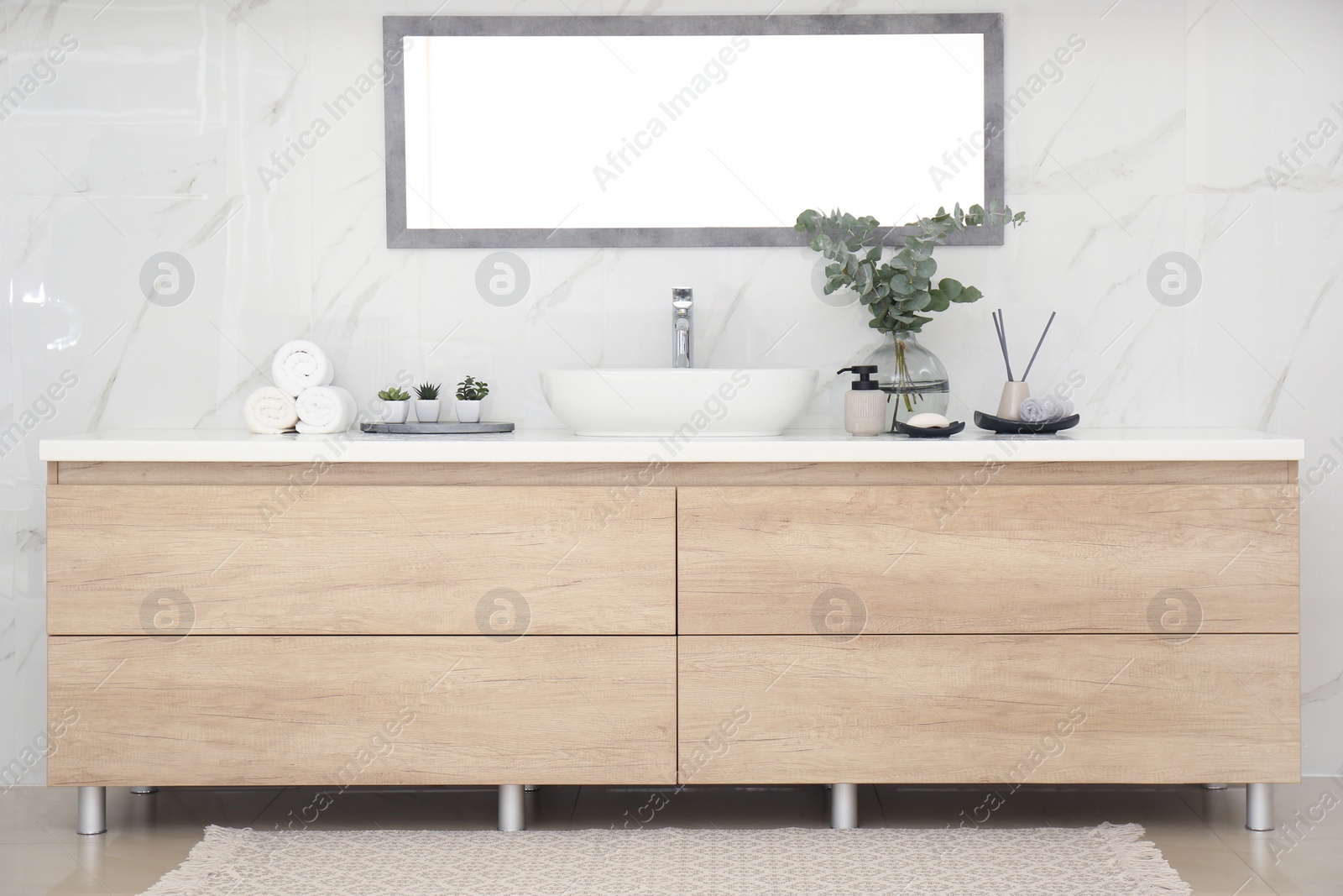 Photo of Modern bathroom interior with stylish mirror and vessel sink