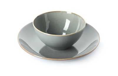 New grey ceramic plate and bowl on white background