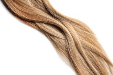 Locks of healthy blond hair on white background