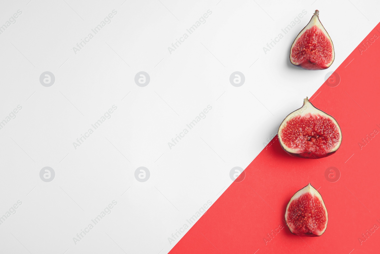 Photo of Delicious ripe figs on color background, flat lay. Space for text