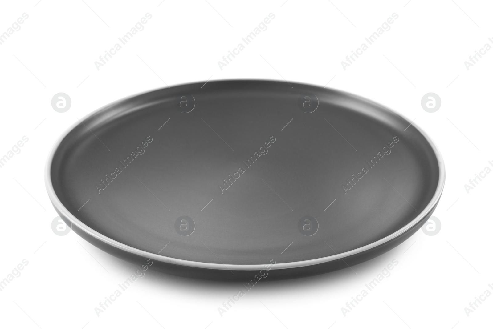 Photo of New empty dark plate isolated on white