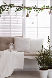 Photo of Beautiful room interior decorated for Christmas with potted firs