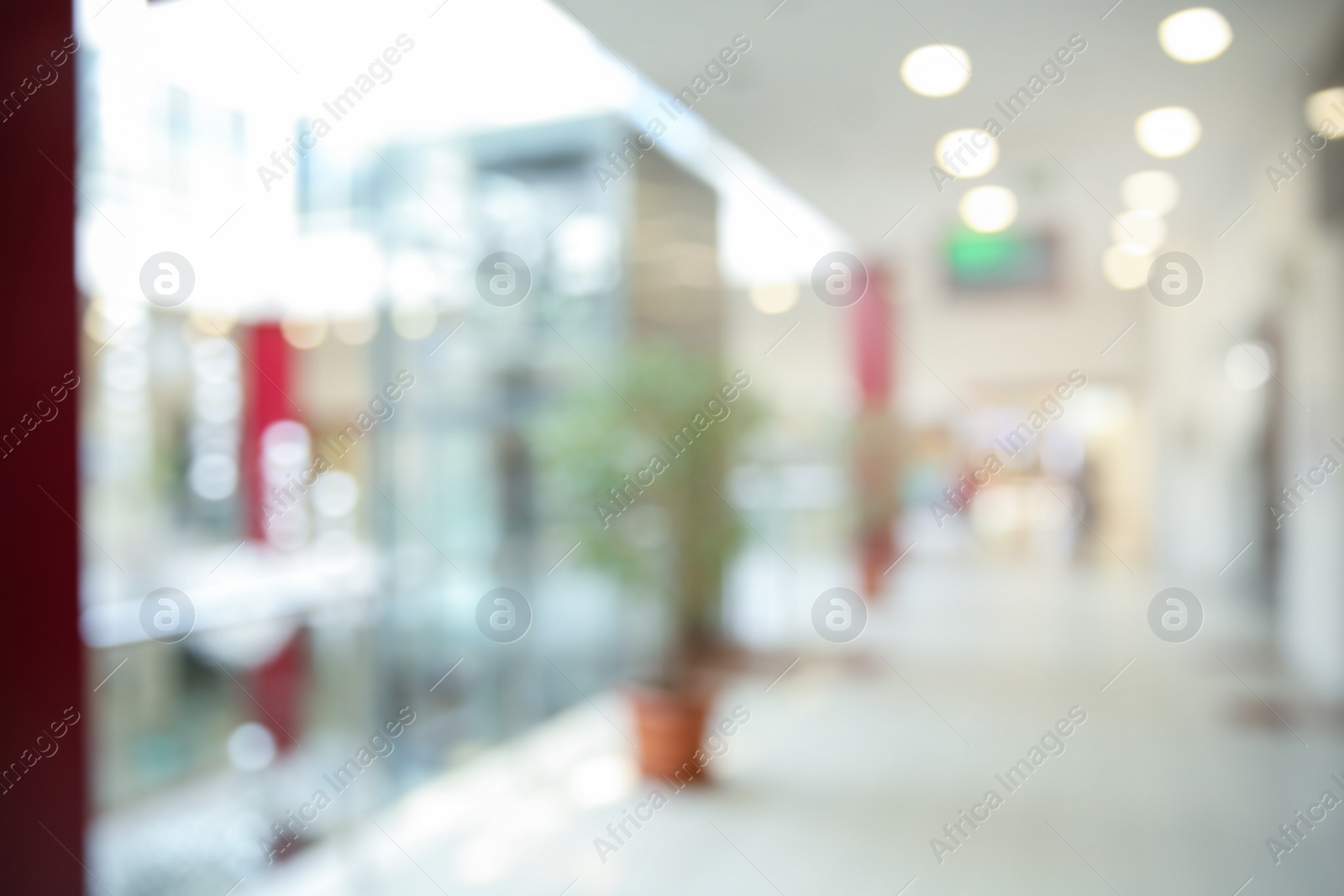 Photo of Blurred view of modern shopping mall interior