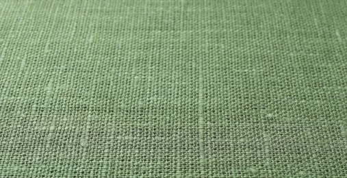 Photo of Texture of green fabric as background, closeup