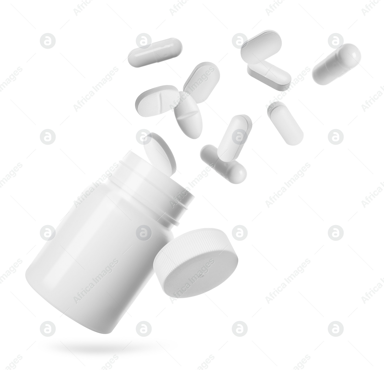 Image of Many different pills falling into bottle on white background