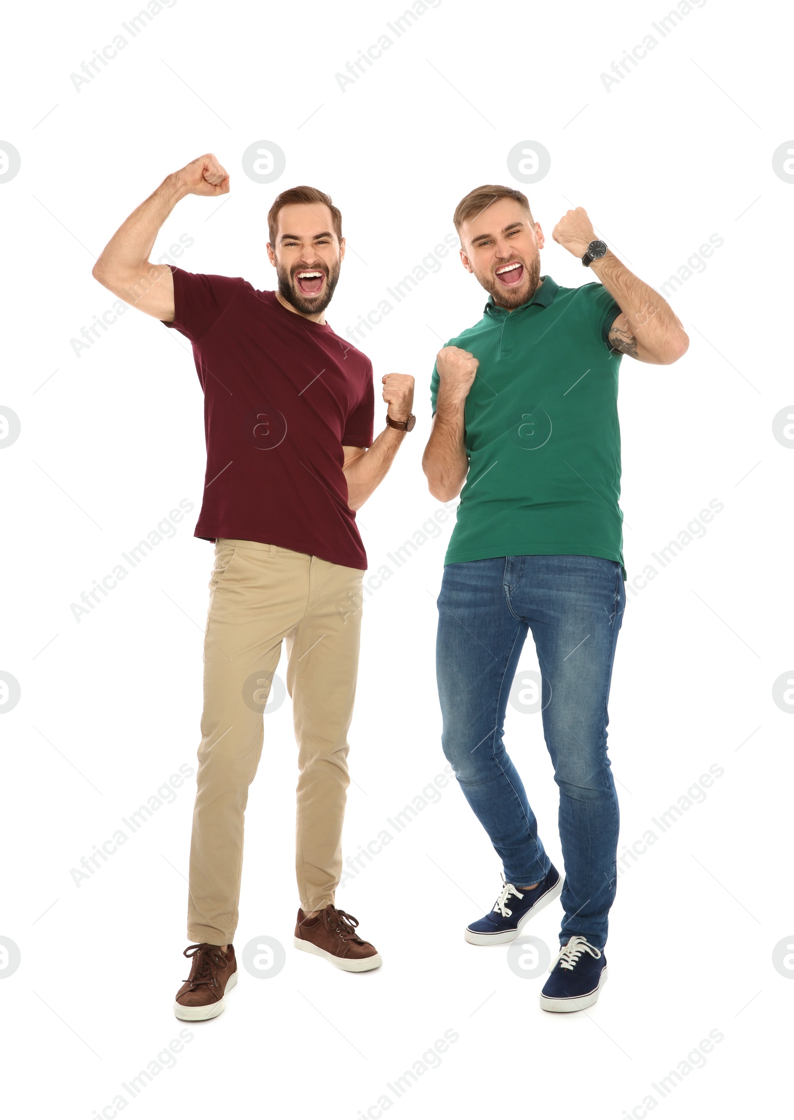 Photo of Young men celebrating victory on white background