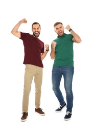 Young men celebrating victory on white background