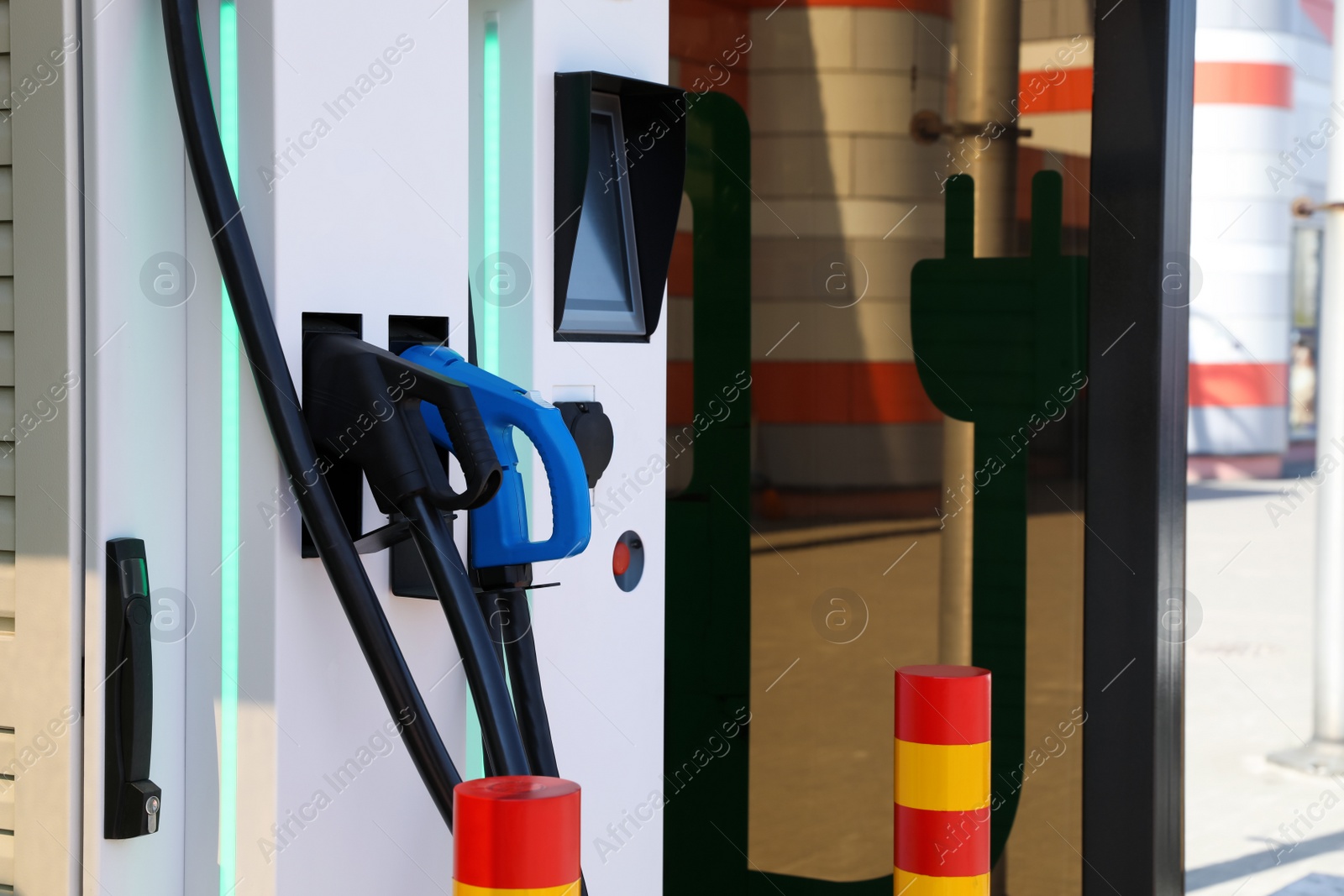 Photo of Modern electric vehicle charging station outdoors, closeup