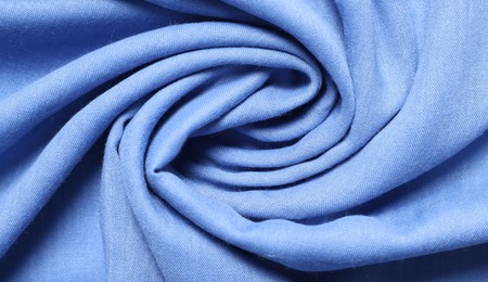 Texture of light blue crumpled fabric as background, top view