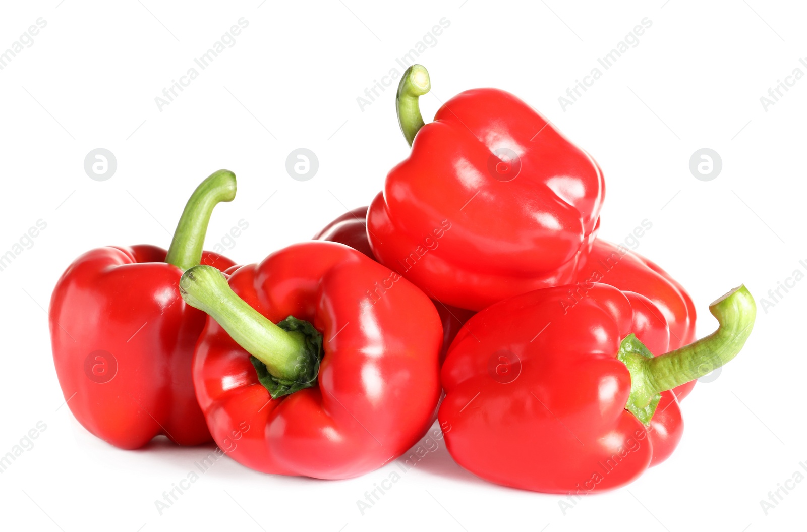 Photo of Tasty ripe red bell peppers on white background