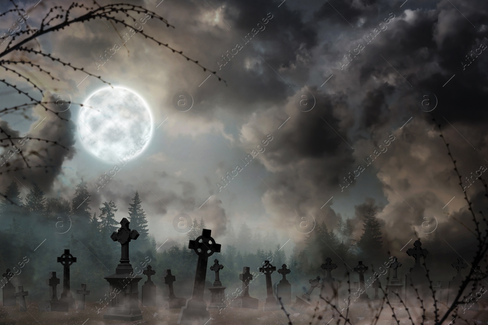 Image of Misty graveyard with old creepy headstones under full moon on Halloweeen