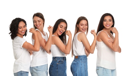 Photo of Happy women posing on white background. Girl power concept