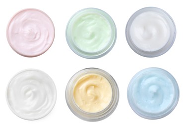 Image of Set with jars of body cream on white background, top view