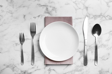 Photo of Elegant table setting on marble table, flat lay