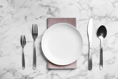 Elegant table setting on marble table, flat lay