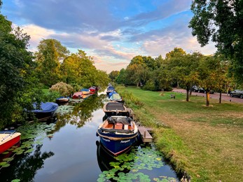 Leiden, the Netherlands - August 24, 2022: Beautiful view of moored boats in canal on sunny day